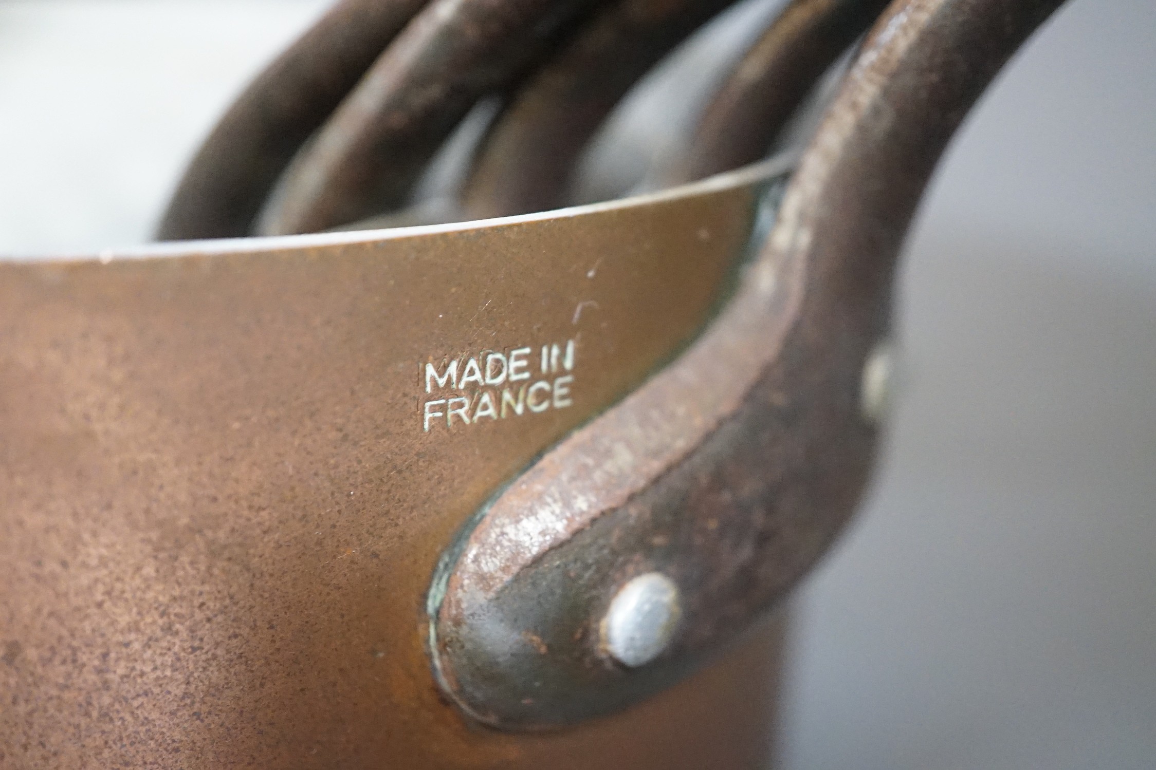 A graduated set of French copper saucepans